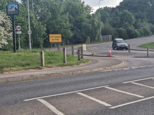 A car driving through the village of Bobbing early on a spring morning