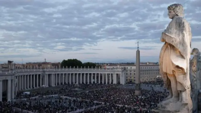 People gather at St. Peter's square on the first day of the conclave