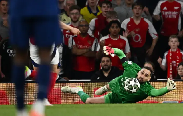 Donnarumma pulls off a save during the first leg v Arsenal in north London