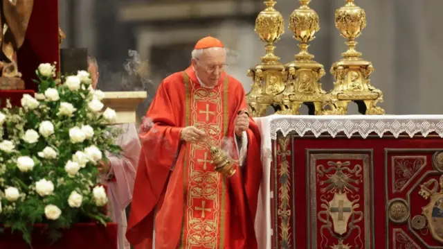 A picture of Giovanni Battista Re in red and gold Catholic attire