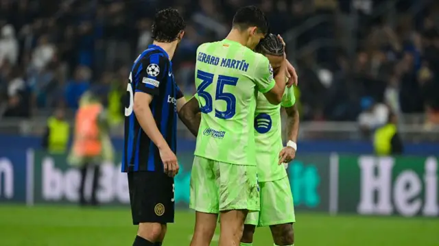 Gerard Martin comforts Raphinha after defeat to Inter Milan