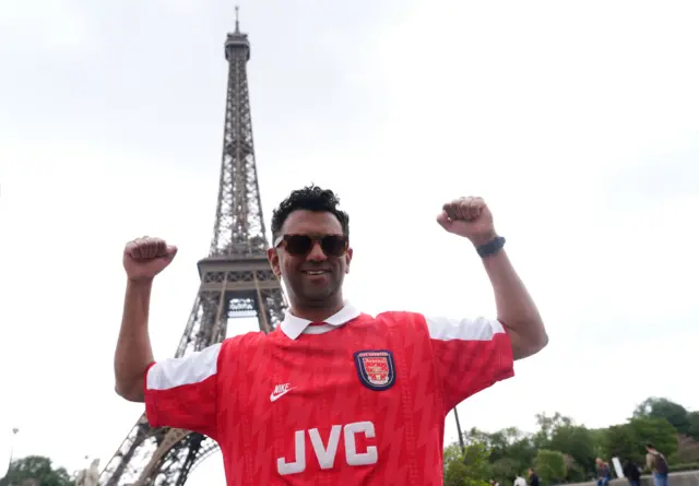 An Arsenal fan sporting an Ian Wright shirt