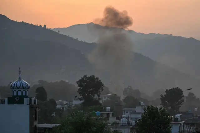 Smoke rises in the main town of Poonch district on May 7, 2025