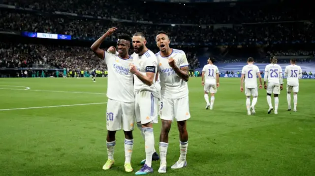Karim Benzema of Real Madrid CF celebrates scoring their third goal with teammates Vinicius Junior and Eder Militao