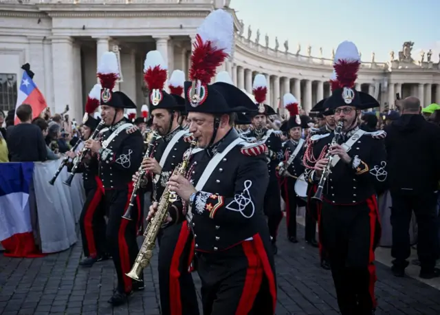 Band members perform in St Peter's square