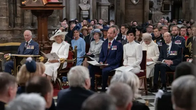 King Charles, Queen Camilla and senior royals sit with veterans and politicians inside Westminster Abbey