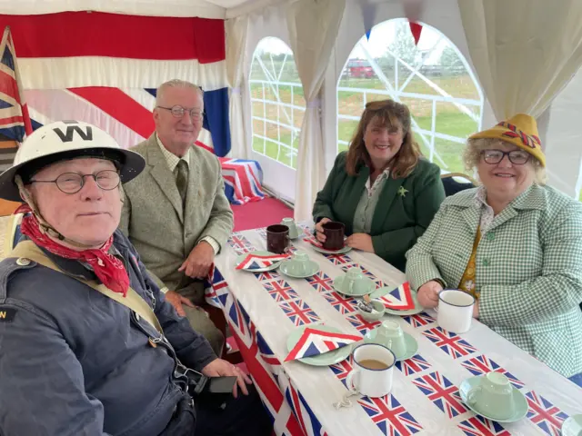 People attending a tea party in Freiston near Boston
