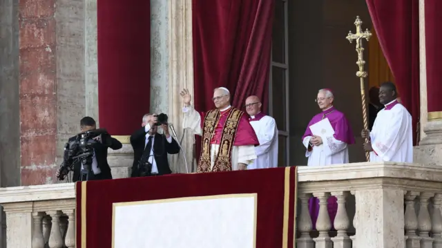 Pope waves from the balcony