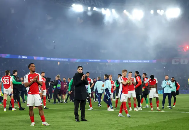 Arsenal squad applaud the away fans