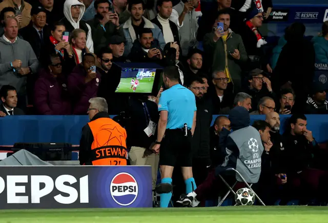 Referee reviews video ahead of PSG penalty decision