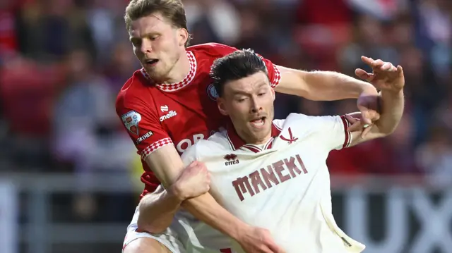 Rob Dickie brings down Kieffer Moore