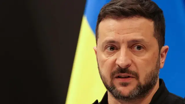 A file photo of Zelensky - he is in front of a Ukrainian flag