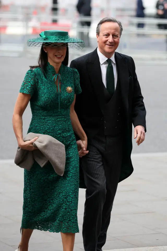 David Cameron and his wife Sam arrive