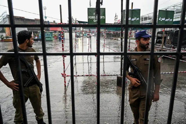 Security personnel cordon off a street near the Rawalpindi cricket stadium after an alleged drone was shot down in Rawalpindi on May 8, 2025.