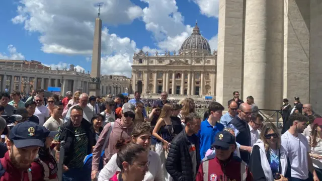 Dozens of people leaving St Peter's Square in the Vatican