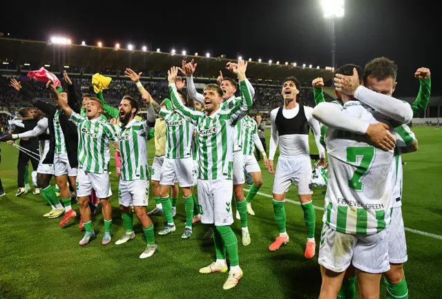 Giovani Lo Celso of Real Betis celebrates towards fans with teammates following their team's progression to the final