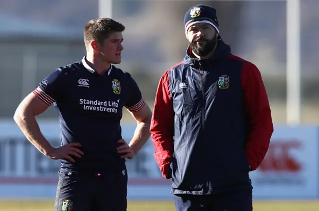 Owen Farrell (L) talks to his father and Lions defence coach Andy Farrell during the British & Irish Lions training session in 2017