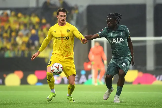 Kasper Hoegh of FK Bodo/Glimt controls the ball under pressure from Yves Bissouma