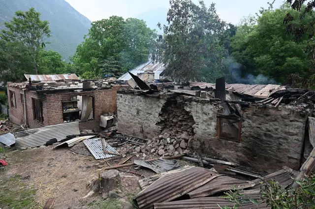 India and Pakistan blame each other for escalating military tensions Rehmat Boutique Damaged houses after a Pakistani artillery shelling, at Salamabad village on May 8, 2025 in Uri, India.
