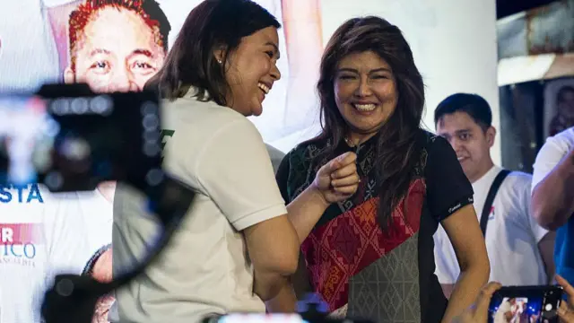 Imee Marcos (right) and Sara Duterte during a campaign event in Manila, the Philippines