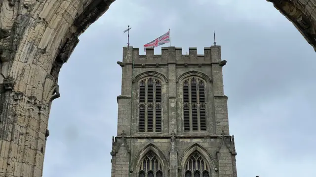 Union Jack flag flies on top of Howden Minster
