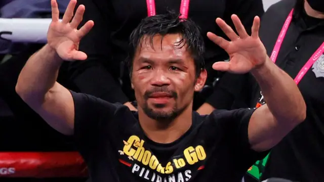 Manny Pacquiao gestures to fans after his WBA welterweight title fight against Yordenis Ugas at T-Mobile Arena on August 21, 2021 in Las Vegas, Nevada.