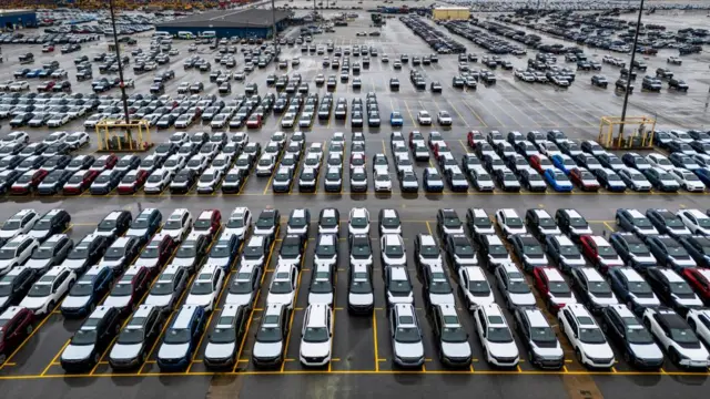 Drone image of multiple Volvo cars awaiting transport.