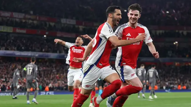 Arsenal players celebrate a goal against Real Madrid in the 2025 Champions League quarter-finals