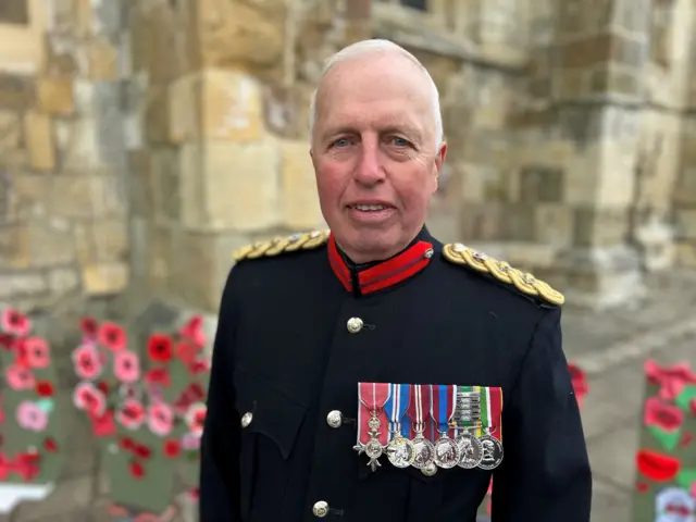 Colonel David Fuller dressed in military uniform and wearing his medals.