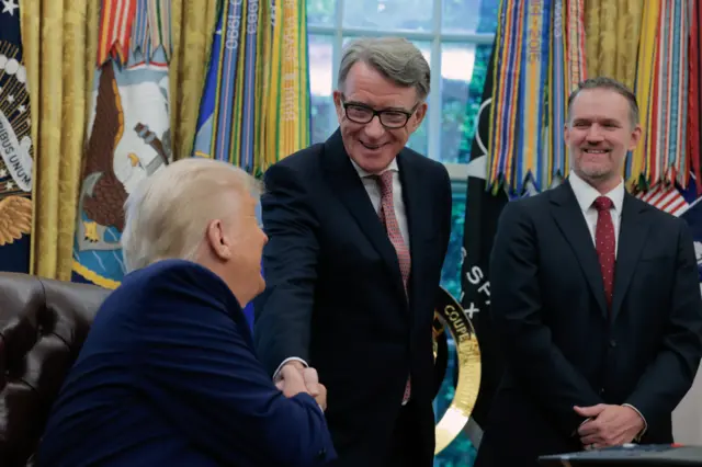 US President Donald Trump (left) shakes hands with the UK Ambassador to the US, Peter Mandelson