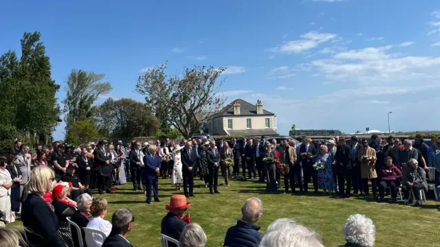 People gathered at a memorial service at the crematorium in Jersey on Liberation Day 2025