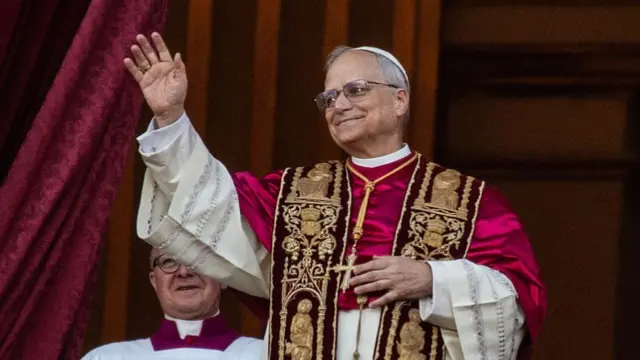 Pope Leo XIV greets the crowd from St. Peter's Basilica after being elected by the conclave on May 08, 2025 in Vatican City, Vatican.