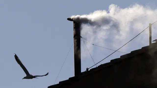 White smoke comes out of the chimney.