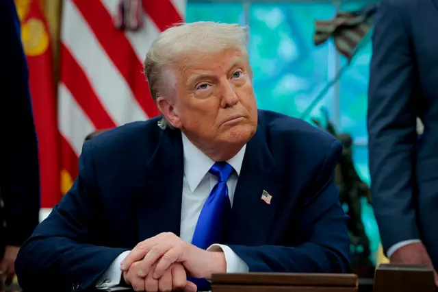 President Trump in Oval Office, speaking to media