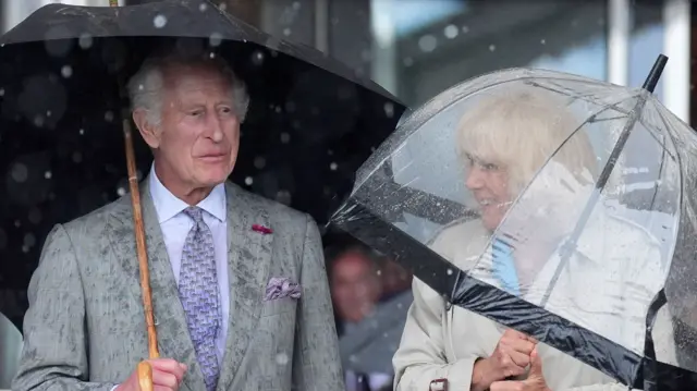 King Charles III (left) and Queen Camilla during the King's Parade at Liberation Square in St Helier, Jersey, during their two-day visit to the Channel Islands in July 2024