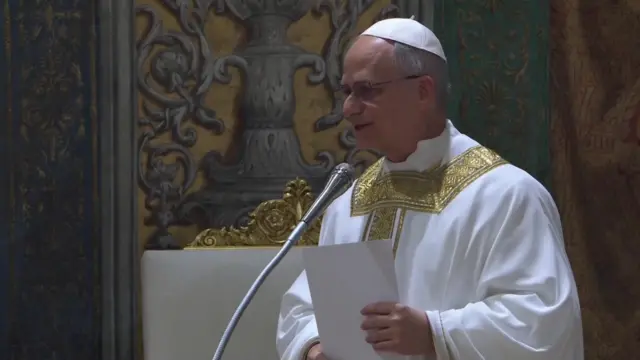 Pope Leo speaking into a microphone