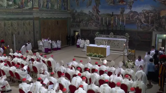 Cardinals changing from red Zucchettos to white Mitres