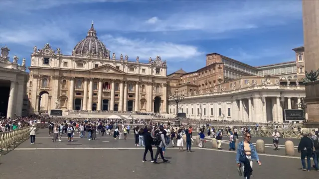 St Peter's Square is seen with people mulling about