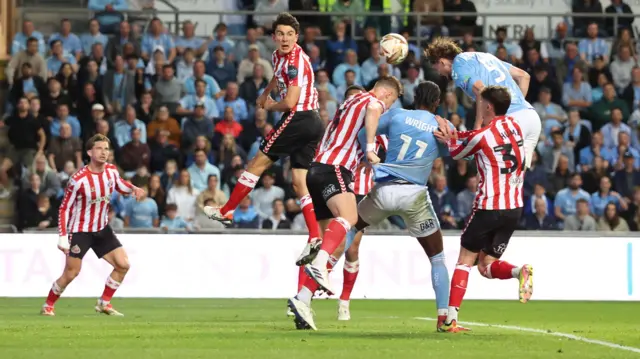 Jack Rudoni scores a header
