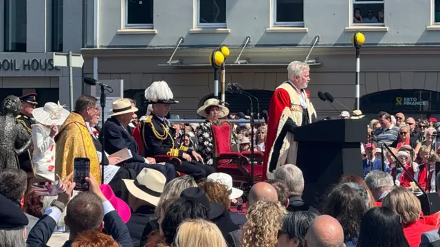 The Bailiff of Jersey Sir Timothy Le Cocq giving a speech in Liberation Square in Jersey on the 80th anniversary of Liberation Day in 2025