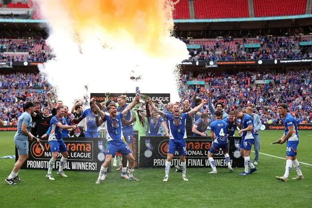 Oldham lift the play-off trophy