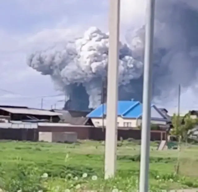 Smoke rises above the area following what local authorities called a drone attack on a military unit in the Sredny settlement