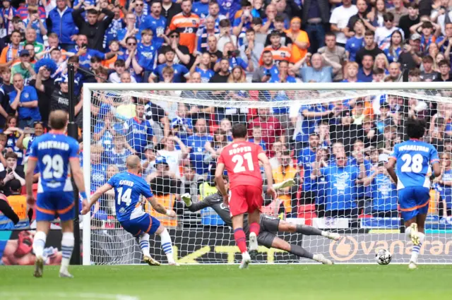 Joe Garner scores a penalty