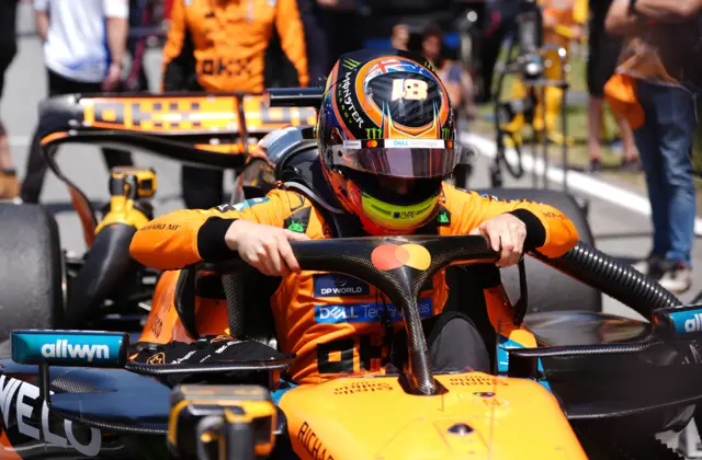 Oscar Piastri getting in his car before the race