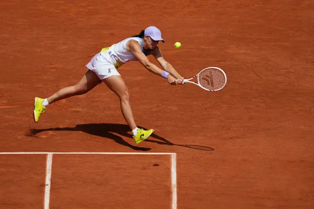 Poland's Iga Swiatek plays a backhand return