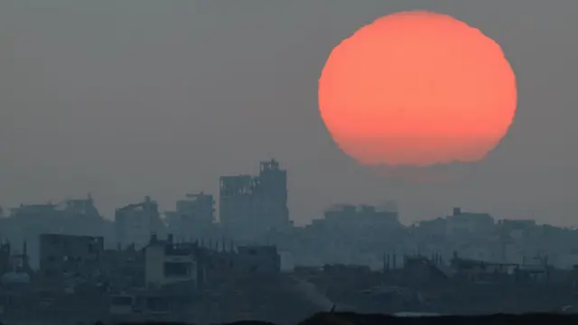 The sun sets over Gaza, as seen from Israel, May 31, 2025