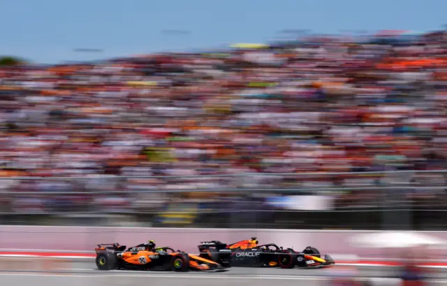 Lando Norris overtaking Max Verstappen