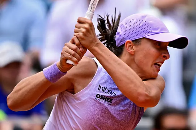 Poland's Iga Swiatek plays a backhand return to Kazakhstan's Elena Rybakina