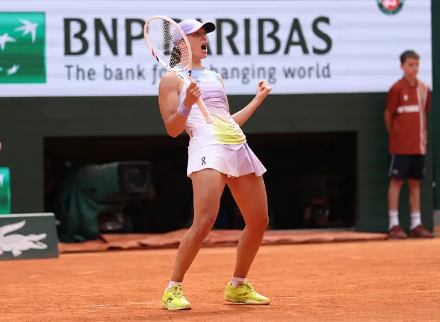 Iga Swiatek celebrates at the French Open