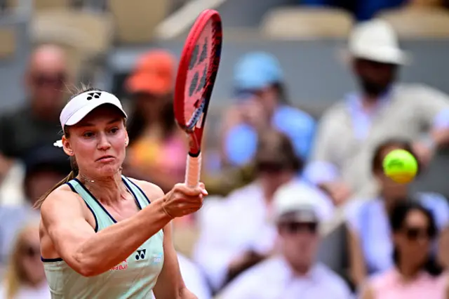 Kazakhstan's Elena Rybakina plays a forehand return to Poland's Iga Swiatek